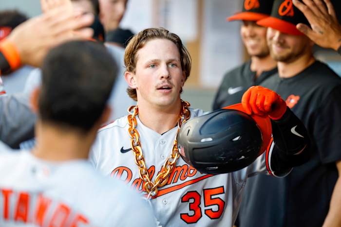 Jun 27, 2022; Seattle, Washington, USA; Baltimore Orioles catcher Adley Rutschman (35) celebrates in the dugout after hitting a solo-home run against the Seattle Mariners during the third inning at T-Mobile Park.